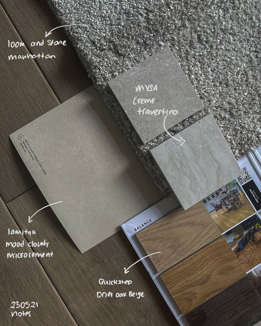 Material samples laid out on site with handwritten annotations